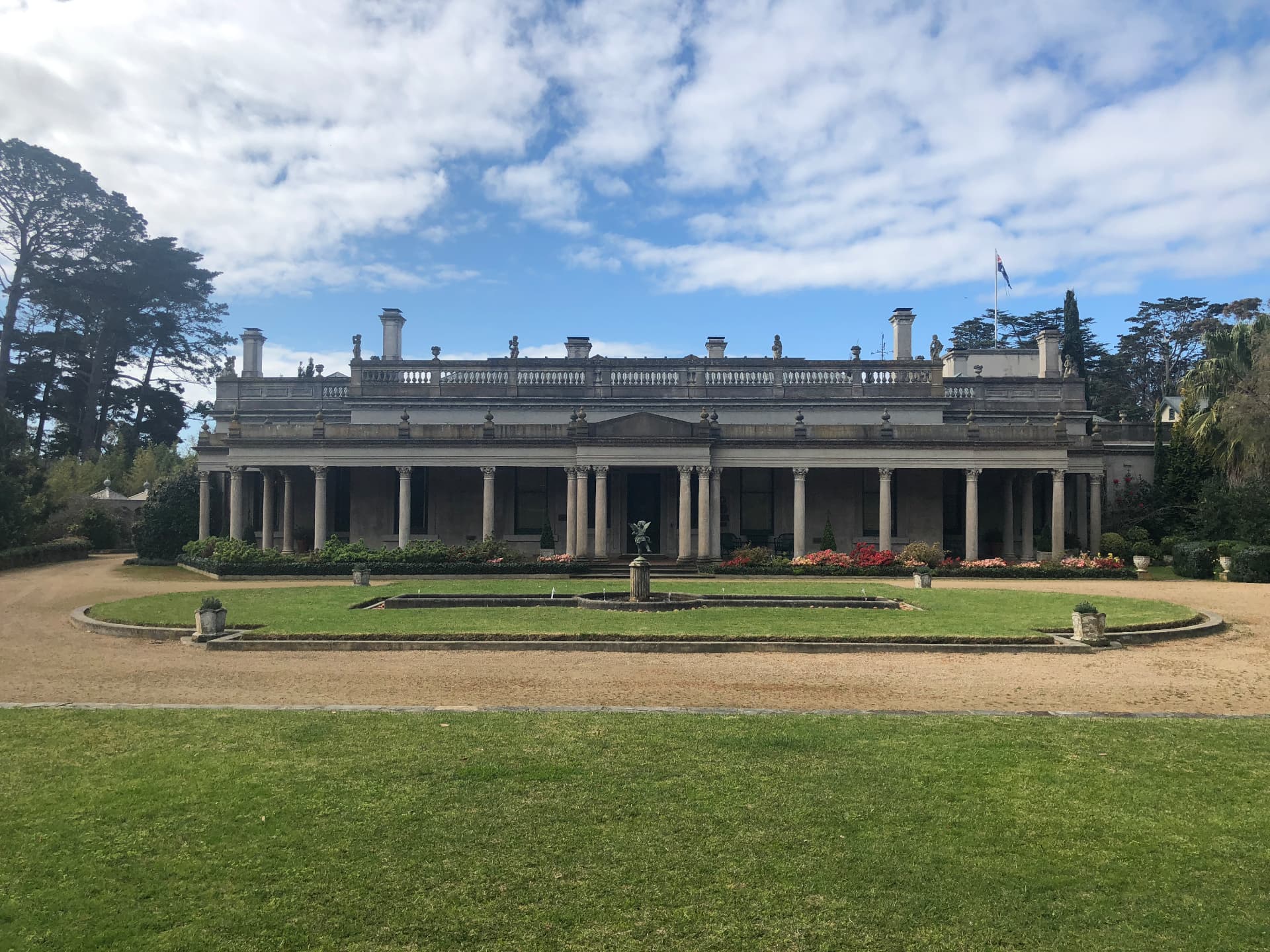 Heritage colonnaded mansion with formal gardens where recitals are held