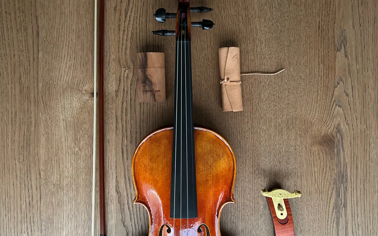 Cello and violin on a wooden floor